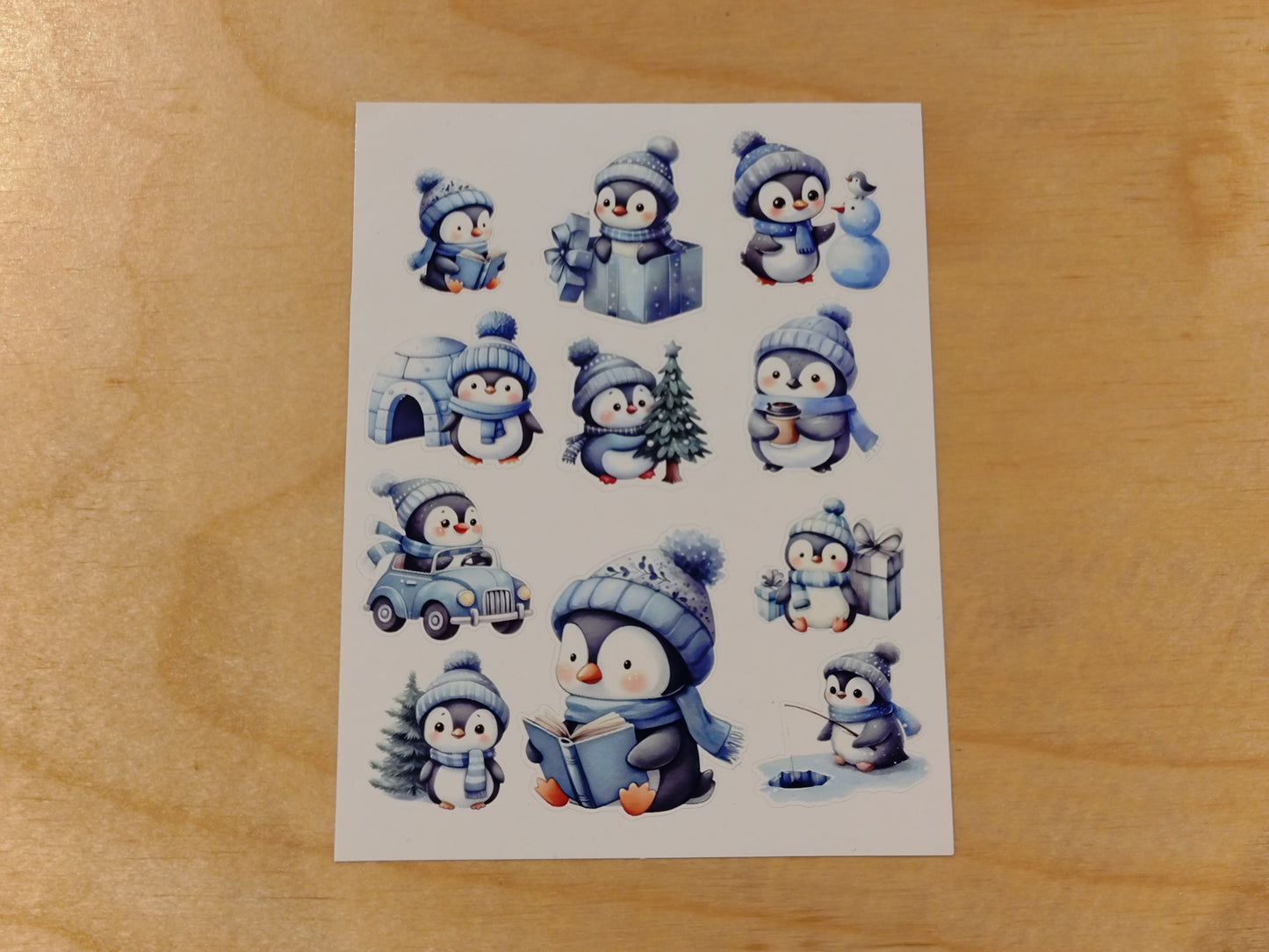 Klistremerkeark med blå vinterpingviner